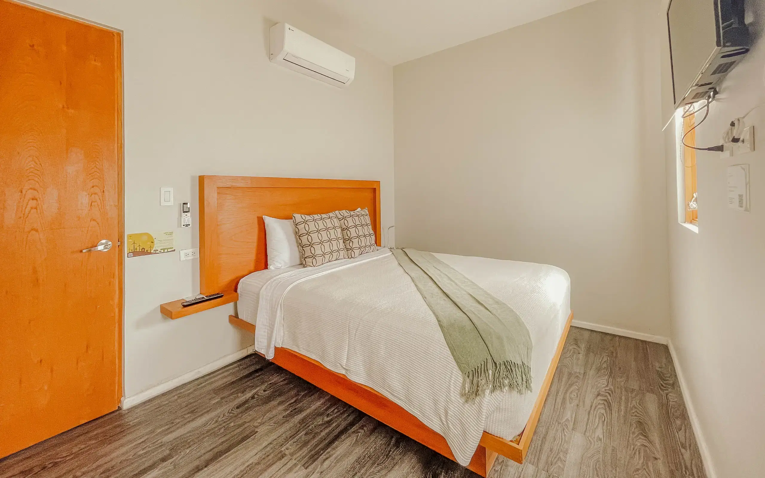 Master suite bedroom with wooden headboard