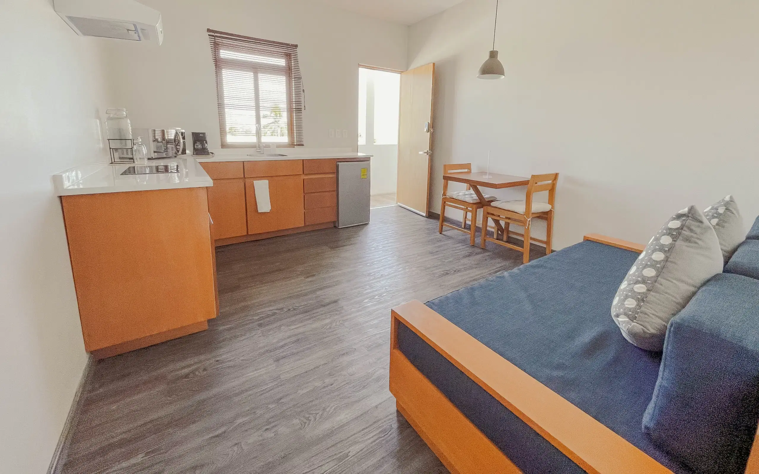 Master suite open plan with kitchen, dining, and living area