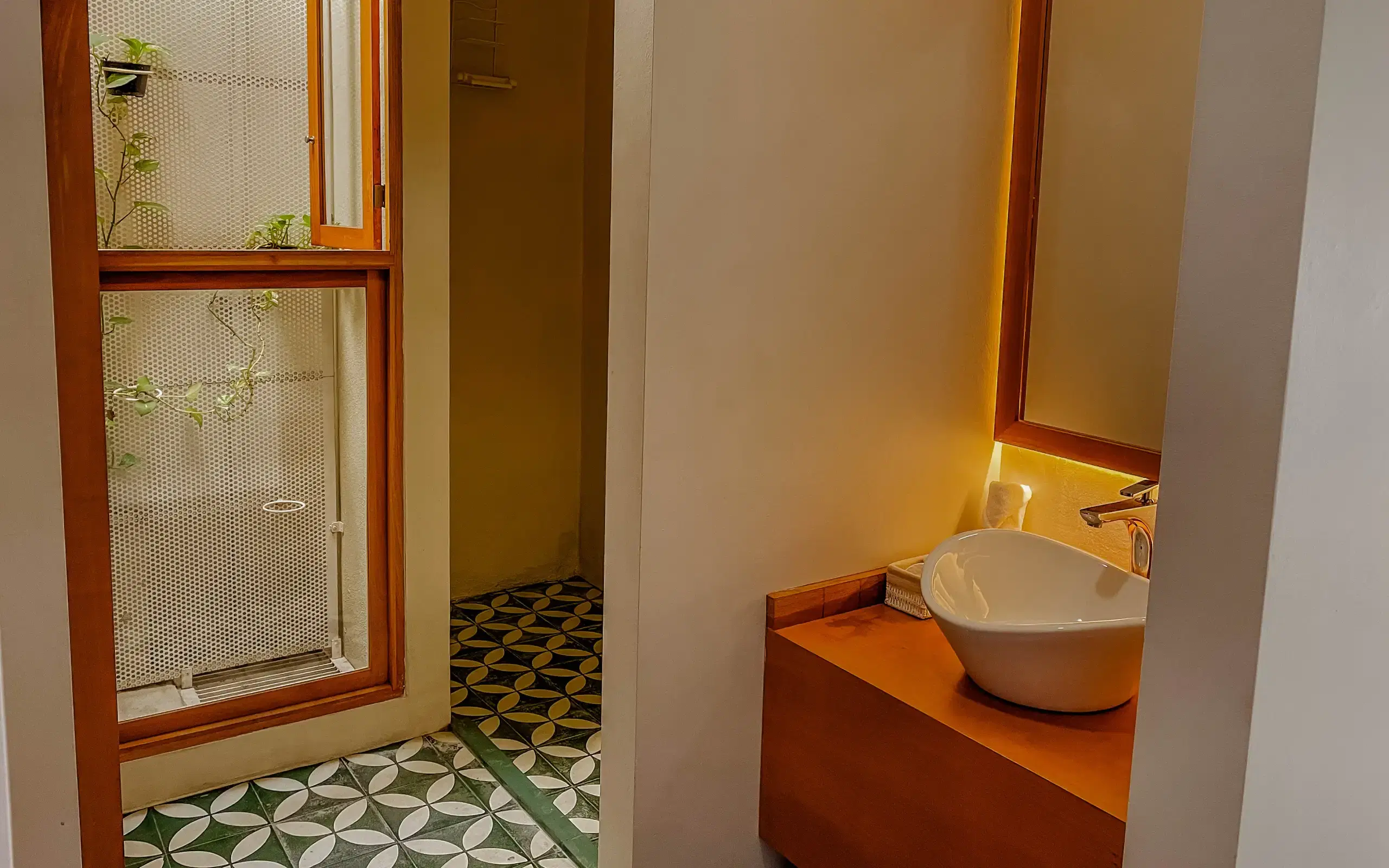 Master suite bathroom with tiled floor and lighted mirror